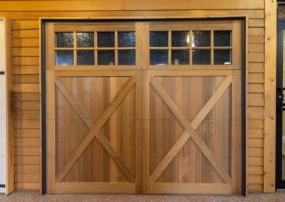 light brown wood garage door with cross beams